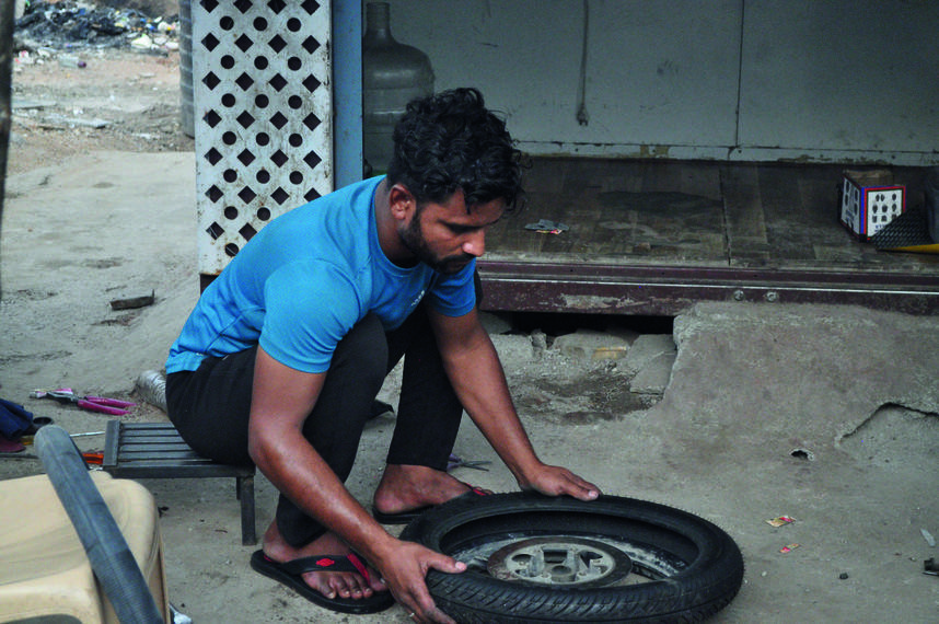 Asif repairing a wheel